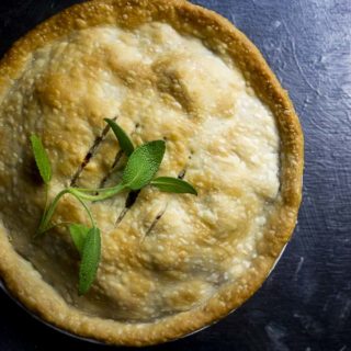 pie garnished with basil leaves