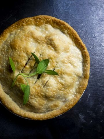 pie garnished with basil leaves