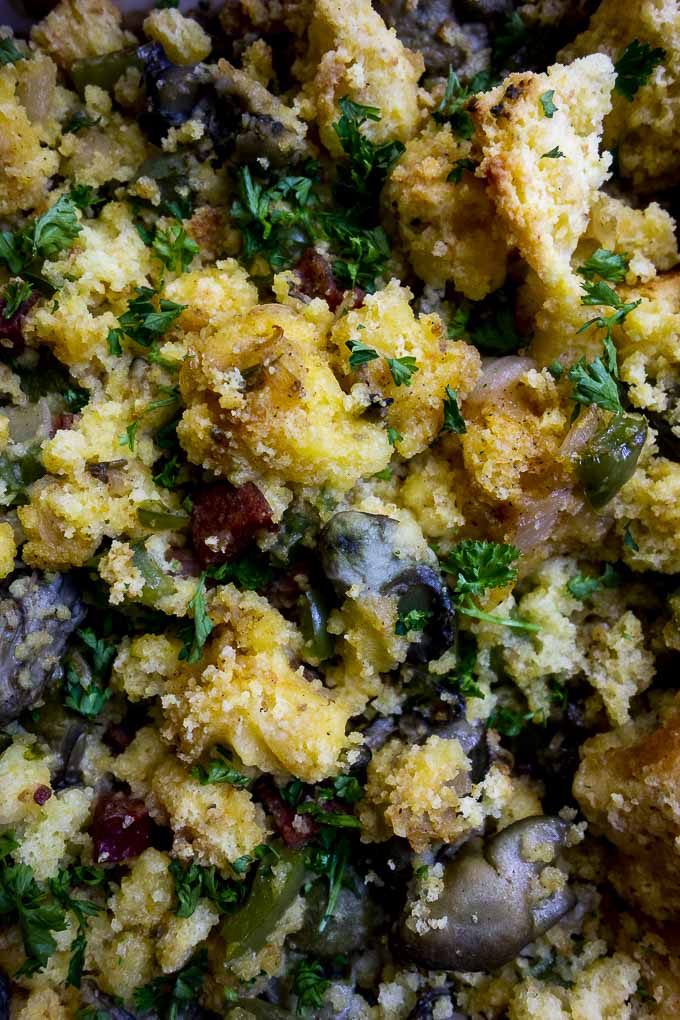 close up photo of oyster cornbread dressing with parsley