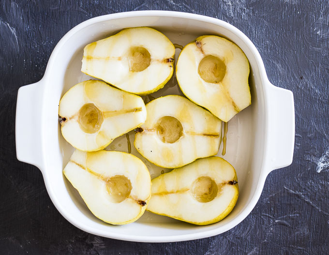 pears drizzled with honey in a baking dish