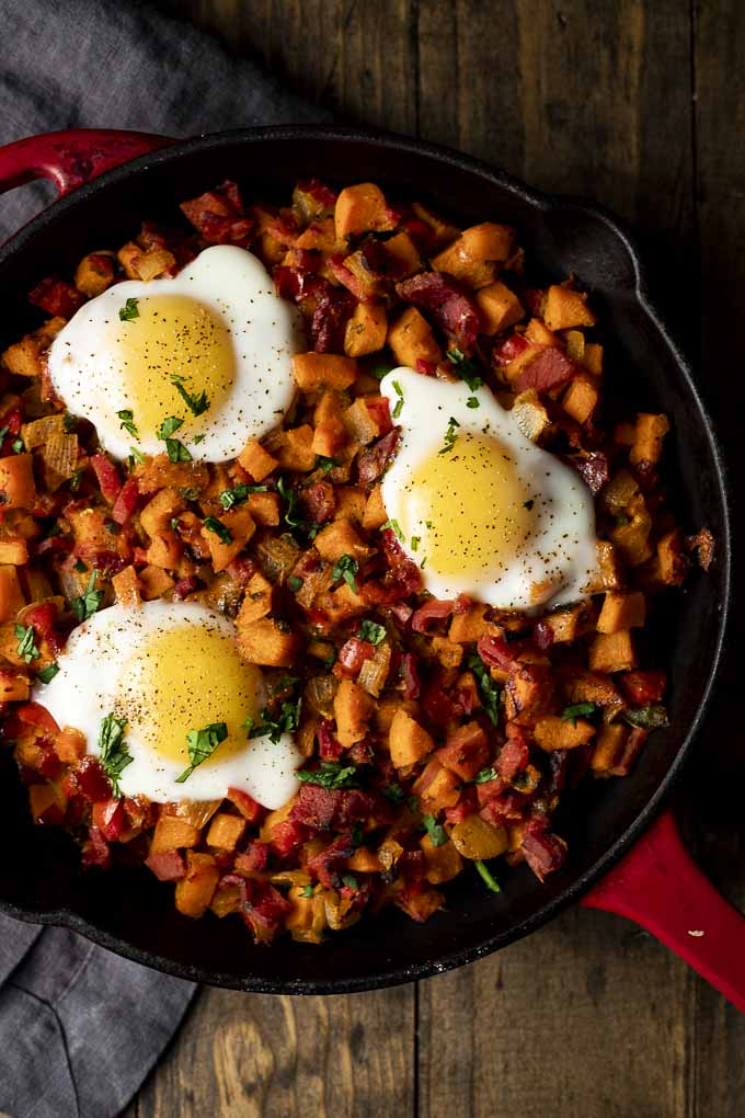 sweet potato hash with 3 eggs on top