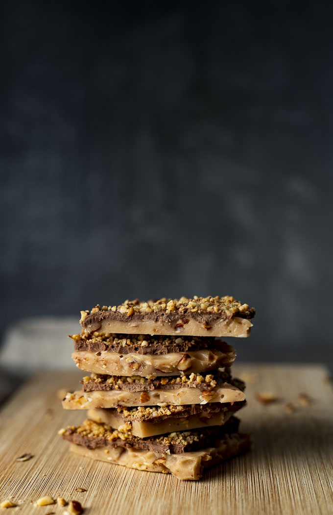 pieces of buttercrunch in a stack on a plate