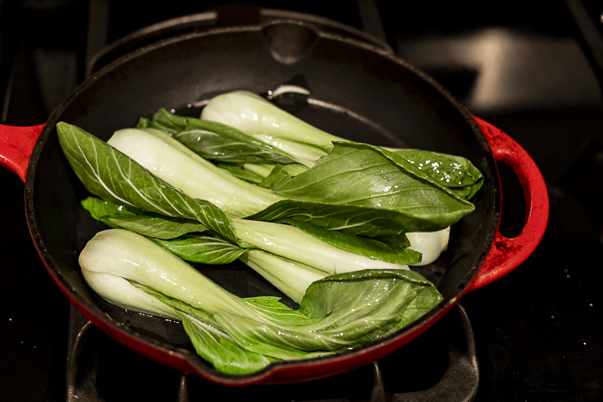 baby bok choy in a skillet