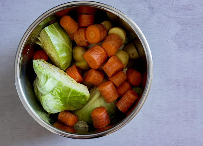 carrots, cabbage and potatoes in a pot