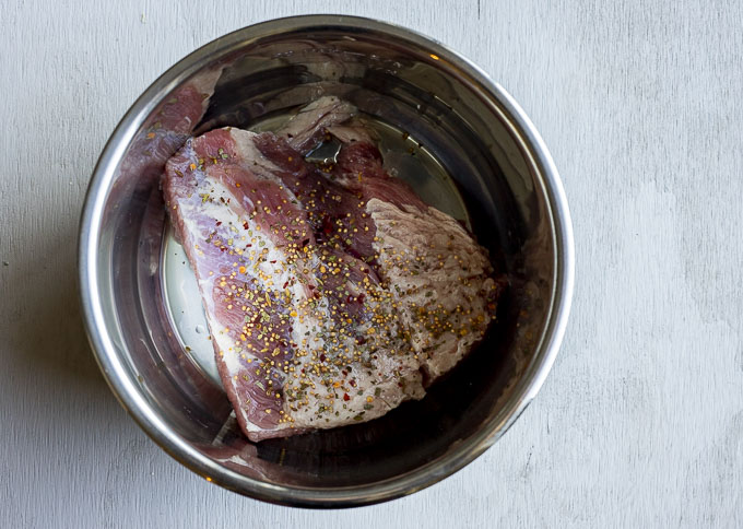 corned beef in a pot with seasonings