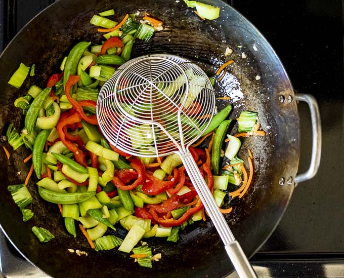 vegetables stir fried in a wok