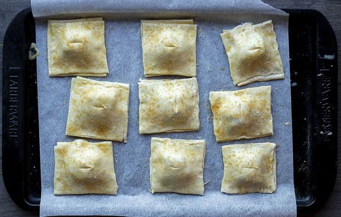 puff pastry squares covered in egg wash and sugar