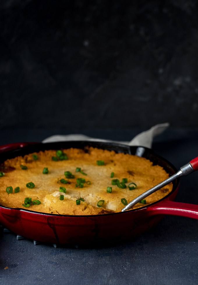 tamale pie baked in a cast iron skillet