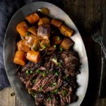 beef, carrots and potatoes on a plate