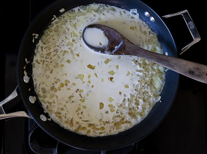 onion gravy cooking in a skilley