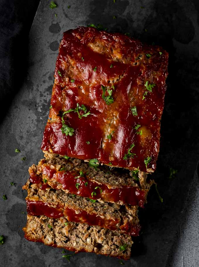 meatloaf covered with ketchup sauce on a platter