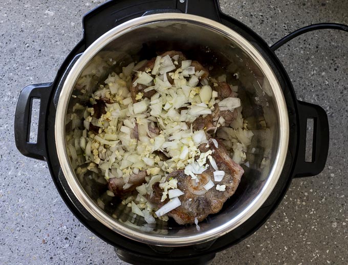 oxtails and onions in a pot
