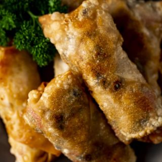 close up photo of several fried egg rolls