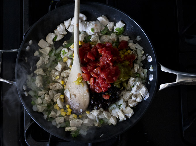chicken and tomatoes in a skillet