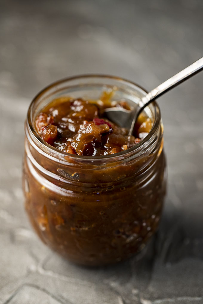 jar of onion jam with a spoon