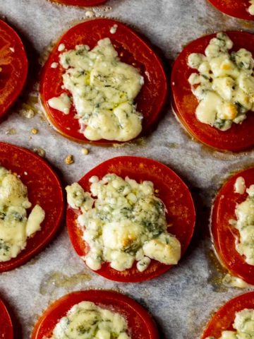 blue cheese on a tomato slice