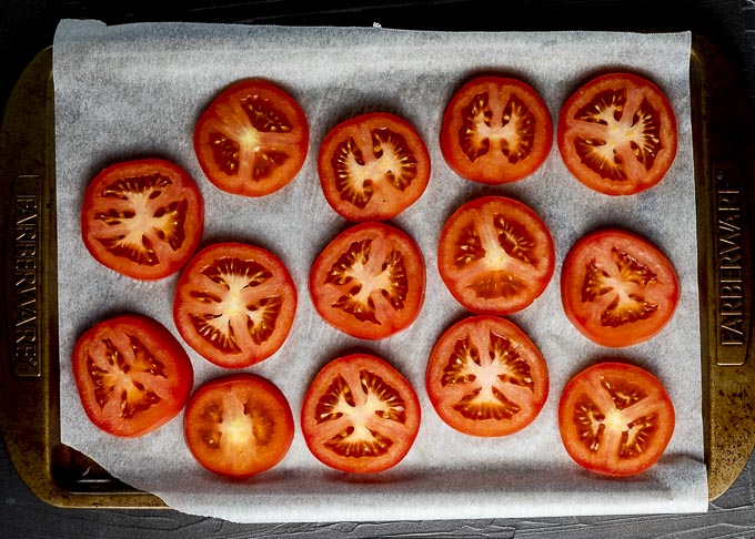 raw tomato slices on a tray
