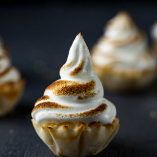 mini pastry cup topped with toasted meringue