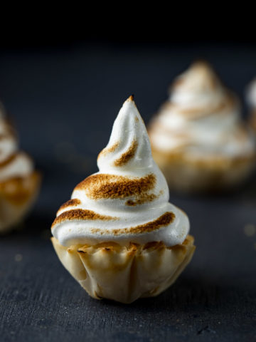 mini pastry cup topped with toasted meringue