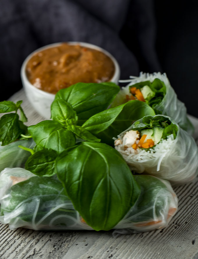 spring rolls on a plate with one cut in half