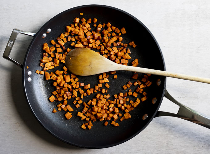 diced sweet potato in a skillet