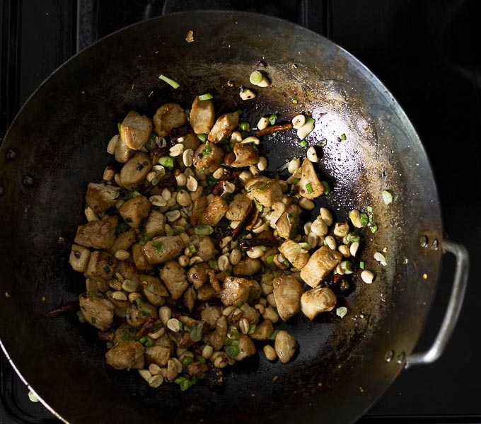 chicken and peanuts in a wok