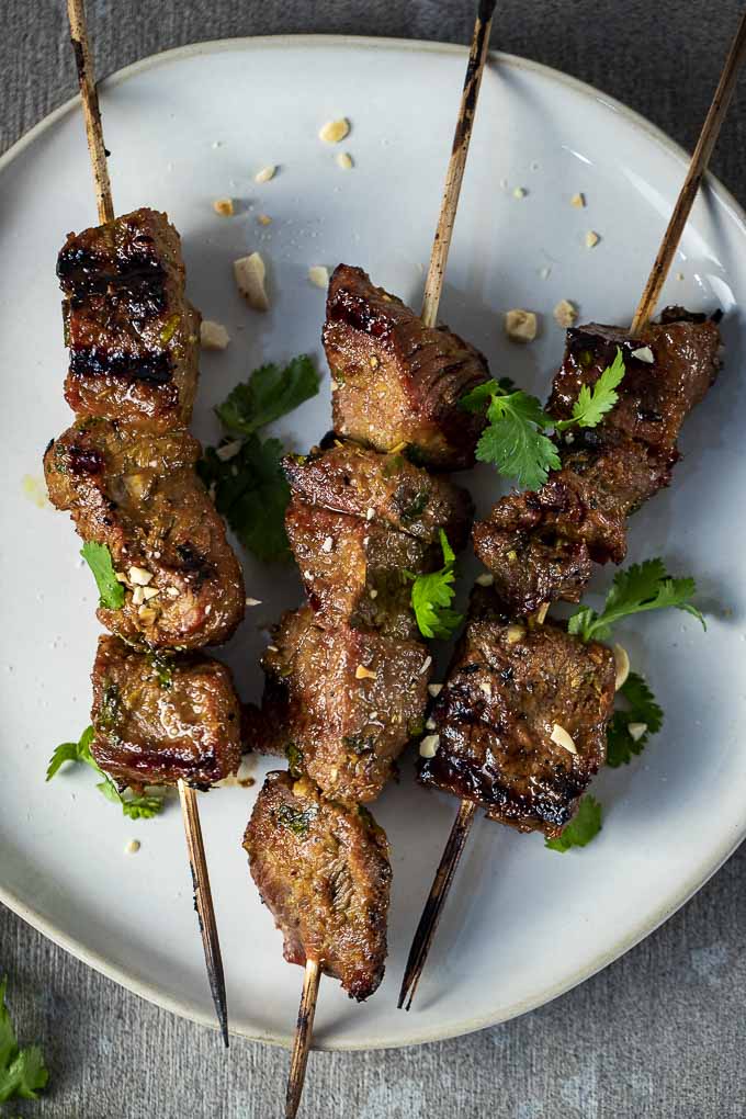 grilled beef satay skewers on a plate