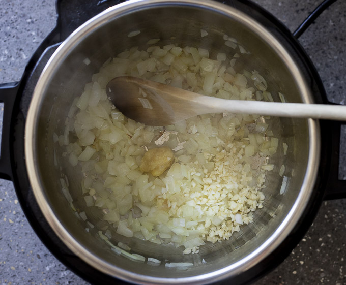 onions and garlic cooking in a pot