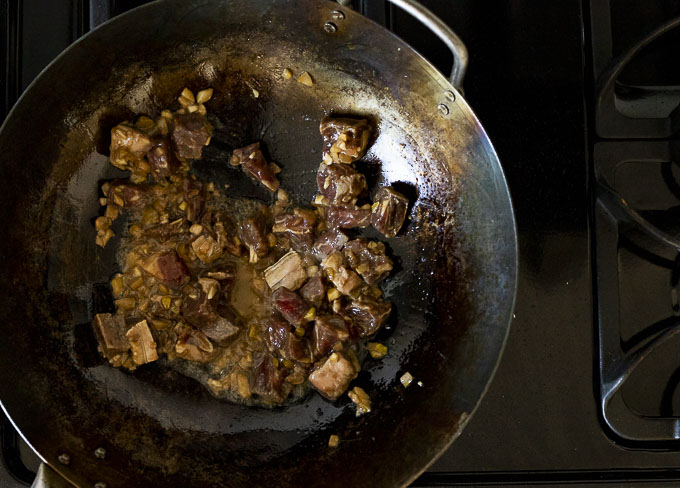 beef fried in a wok
