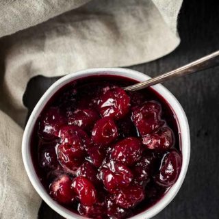 candied cherries in a bowl with a spoon