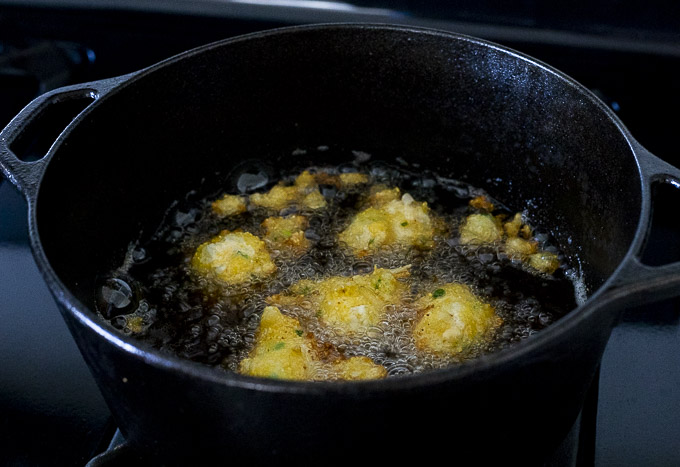 hush puppies frying in a pot
