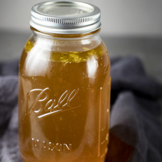 glass jar filled with broth