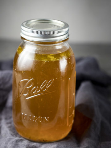 glass jar filled with broth