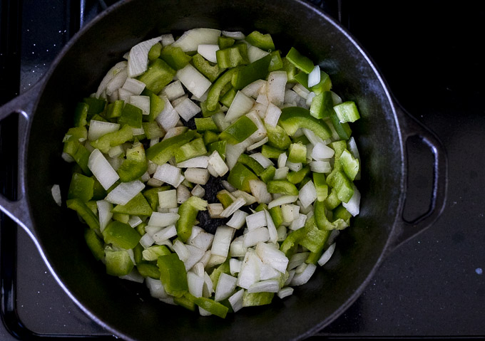 onions and green peppers in a pot