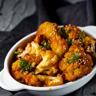 dish of spicy roasted cauliflower with green onions