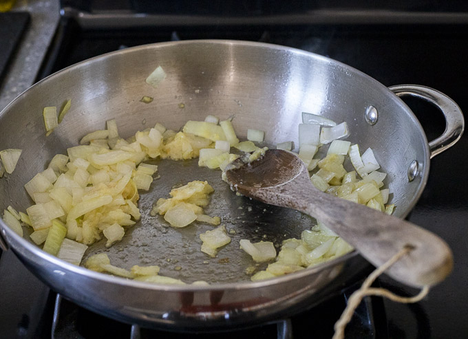 onions sauteing in a skillet