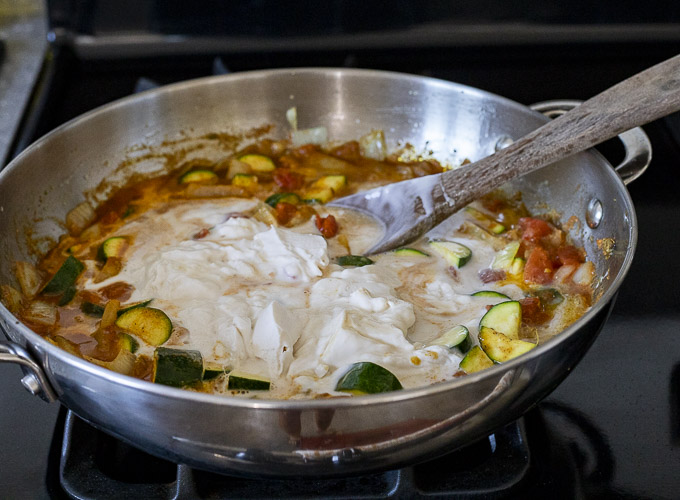 vegetables with coconut milk in a skillet