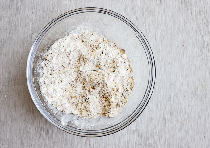 flour and crushed almonds in a glass bowl