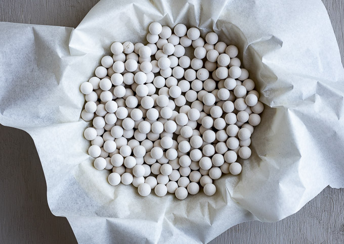 round balls in parchment paper in a pie crust