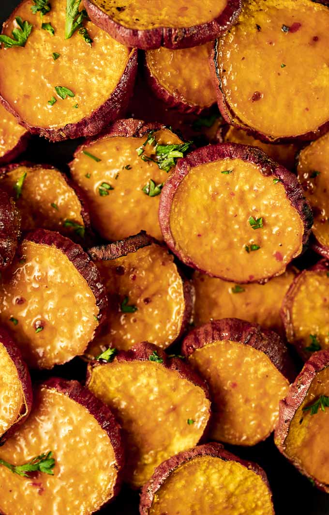 sweet potato slices in glaze garnished with parsley