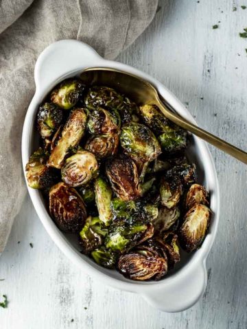 dish of glazed brussels sprouts with a spoon