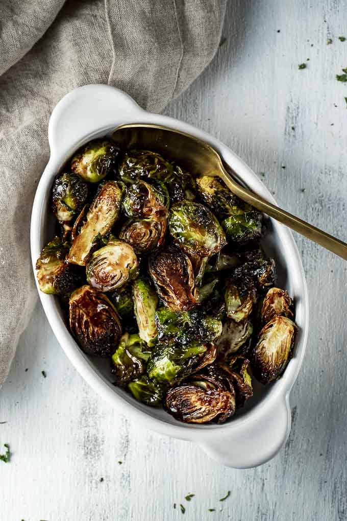 dish of glazed brussels sprouts with a spoon