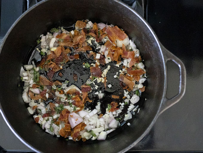 onions and bacon cooking in a pot