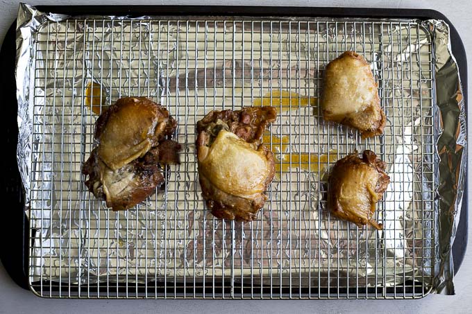 chicken thighs on a baking sheet
