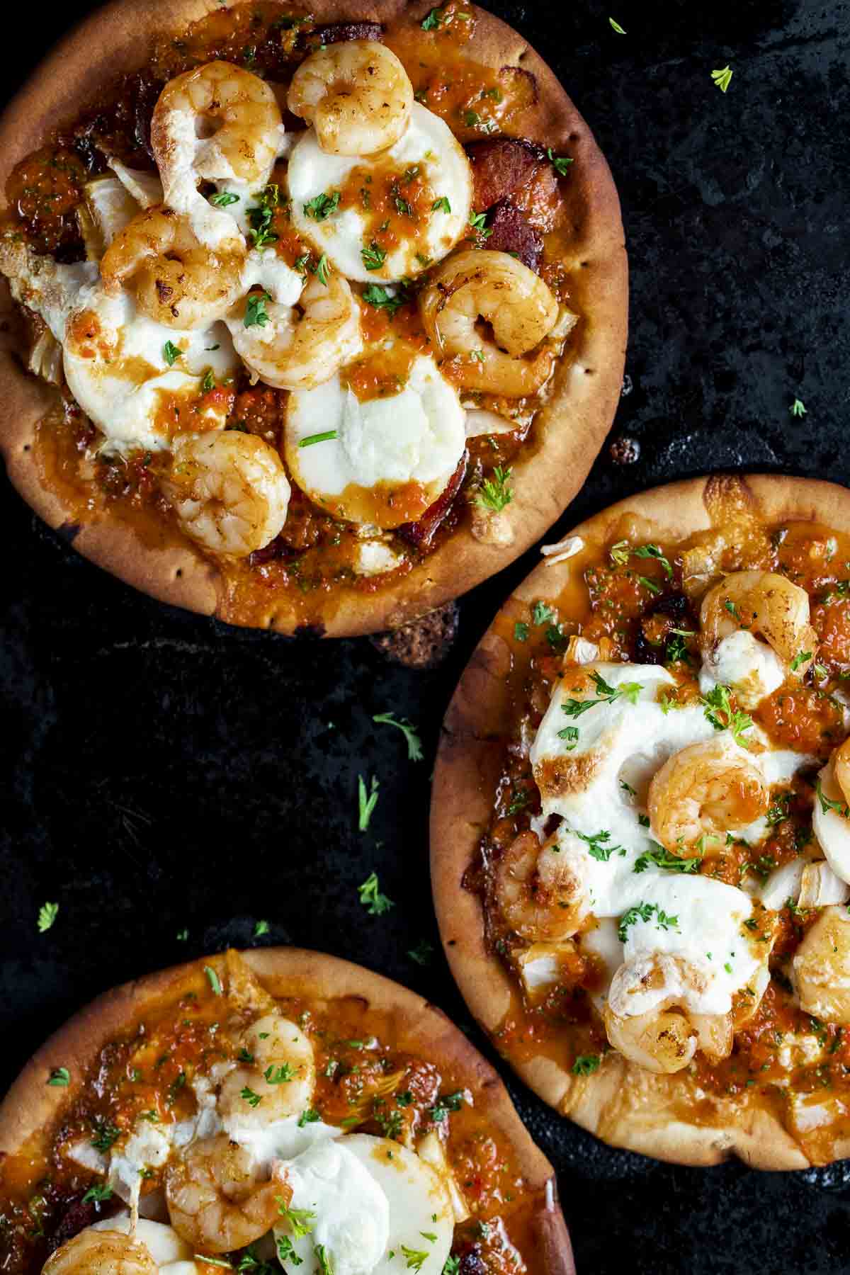 pita flatbreads with melted cheese and shrimp