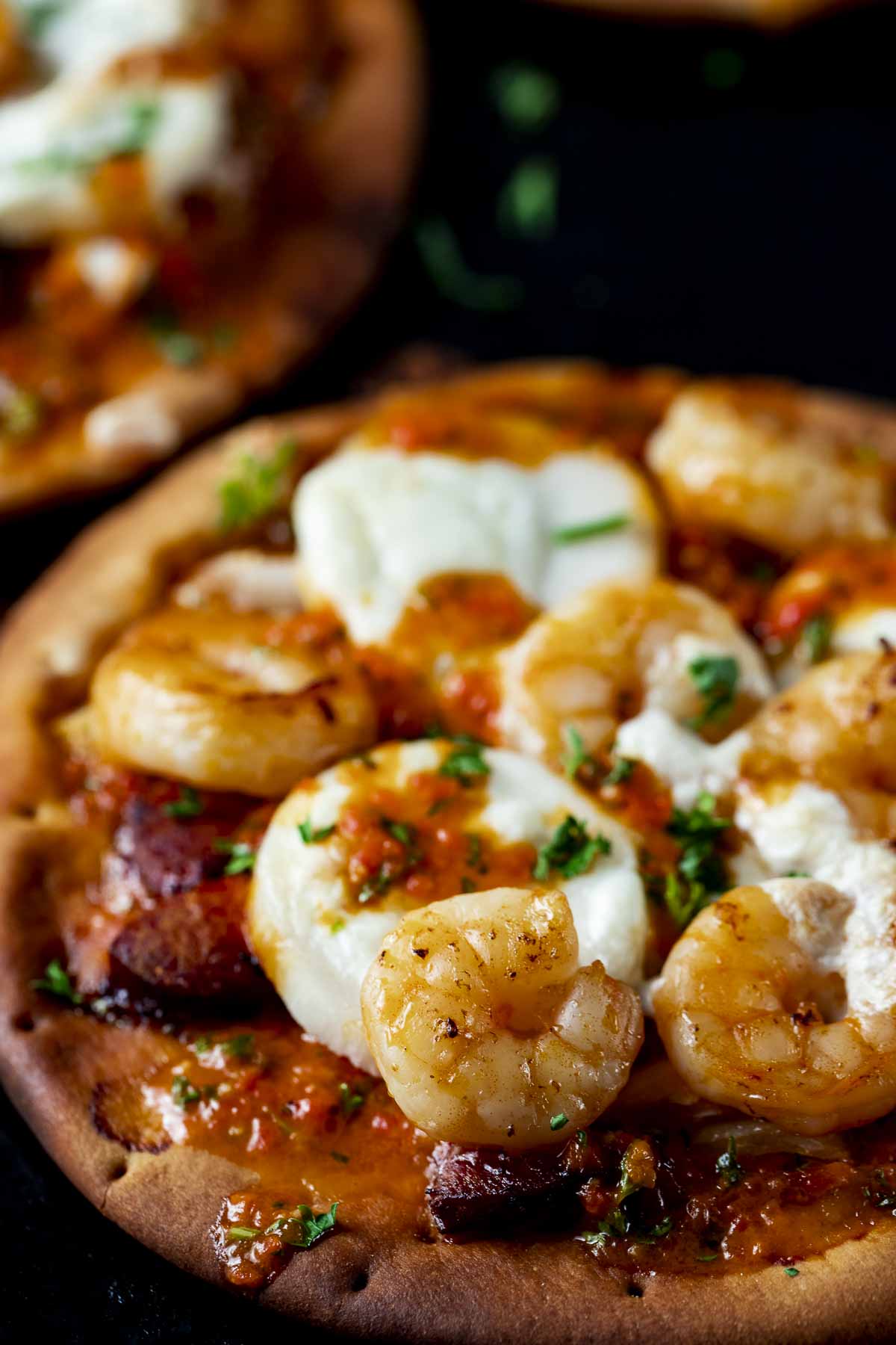 brazilian pizza on pita bread topped with shrimp sausage and cheese