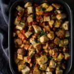 stuffing with red peppers and cilantro in a baking dish