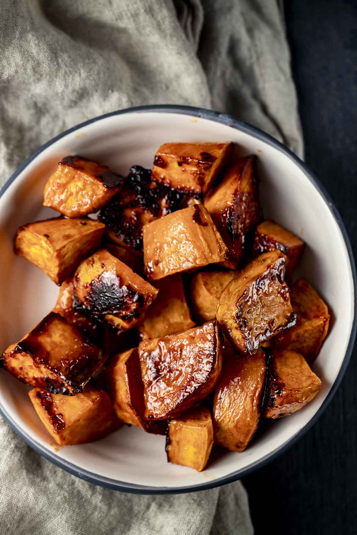 a bowl of caramelized sweet potatoes cut in cubes