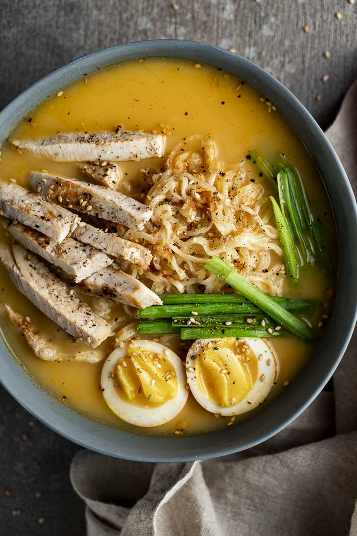 bowl of ramen soup with eggs and turkey