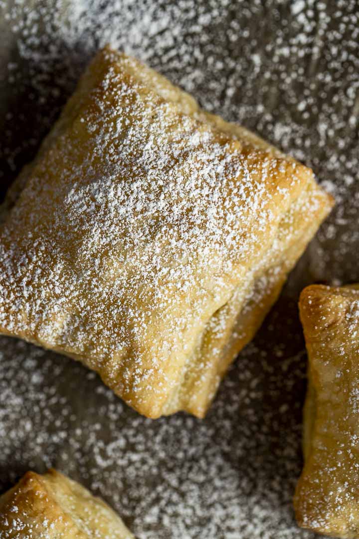 baked puff pastry square sprinkled with powdered augar